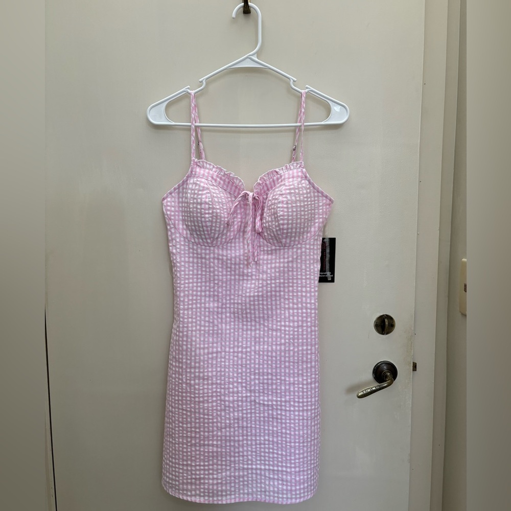 Pink gingham print mini dress.